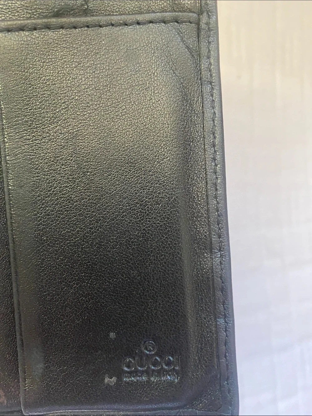 Gucci Dark Brown GG Embossed Leather Bi-Fold Wallet